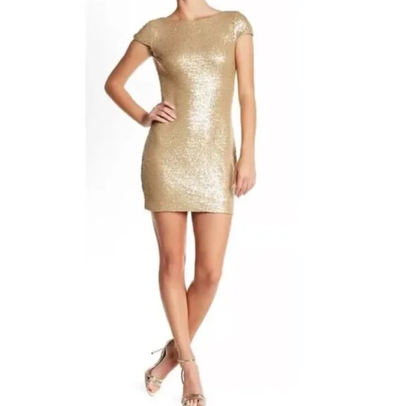 Tobi Dresses & Skirts - 🛍️B2G1 FREE🛍️Outfit: NWT earrings & NWT Angie metallic dress